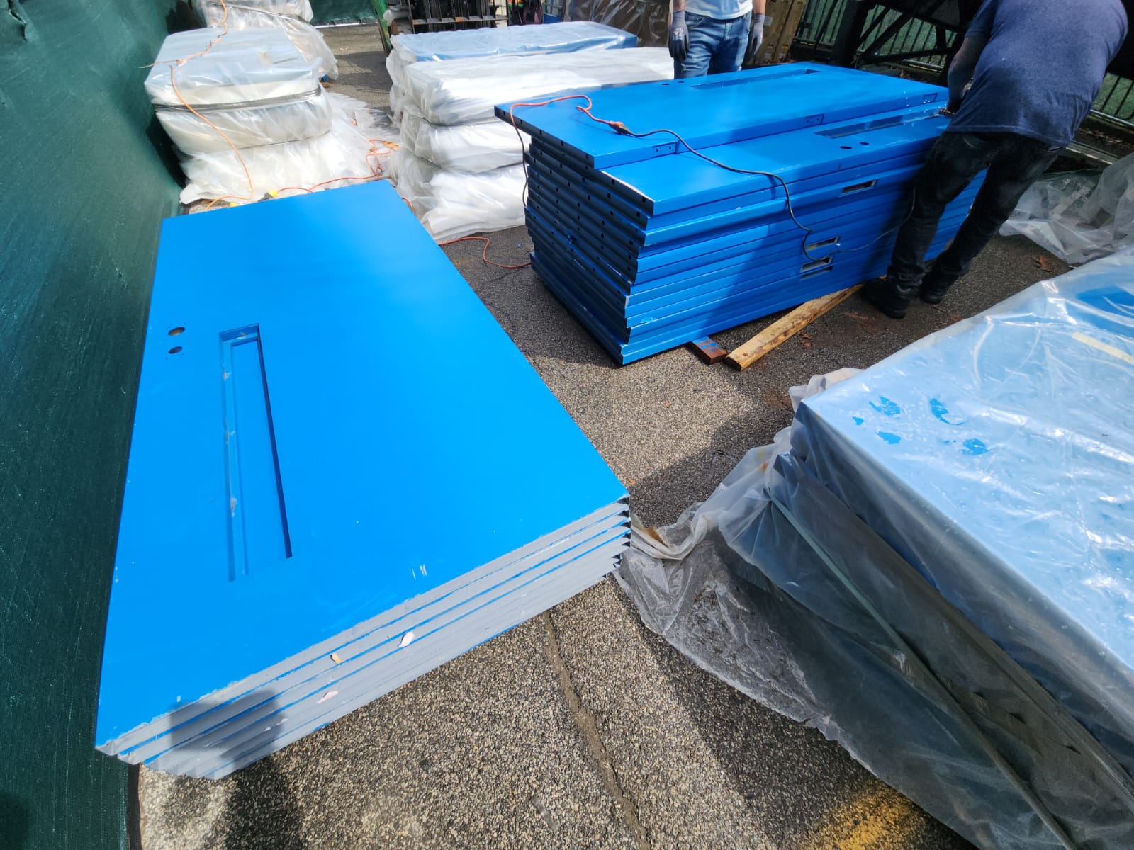 Stacks of new fire-resistant doors are ready for installation.