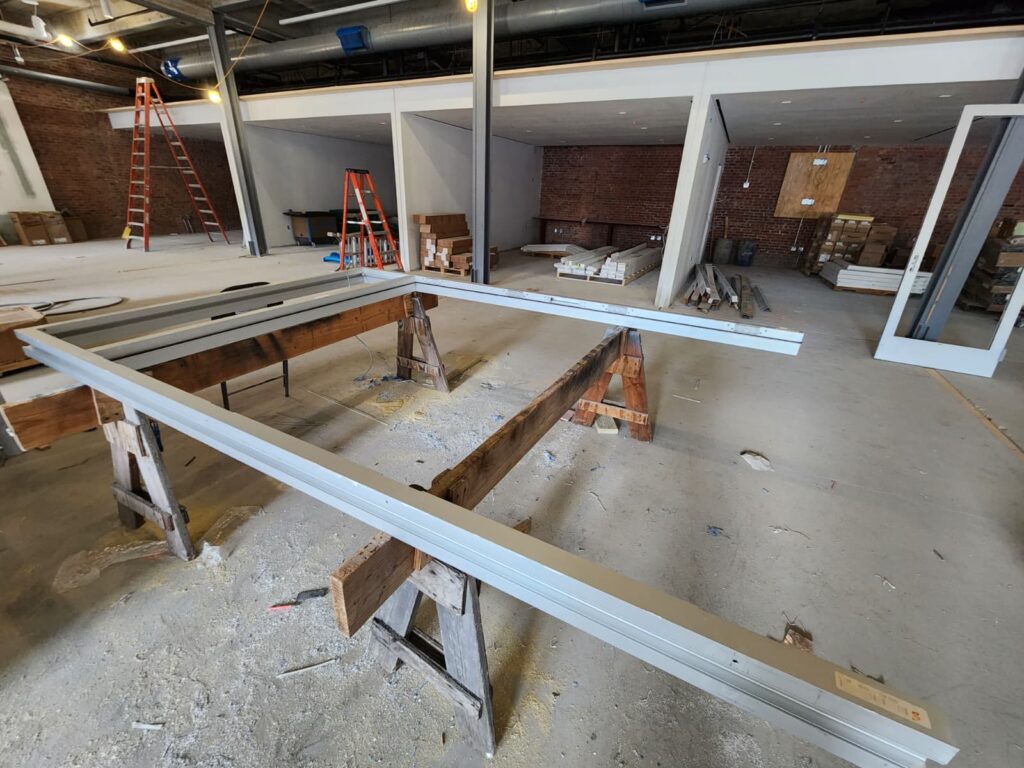 On-site fabrication of a custom aluminum door from raw materials at the College of Staten Island