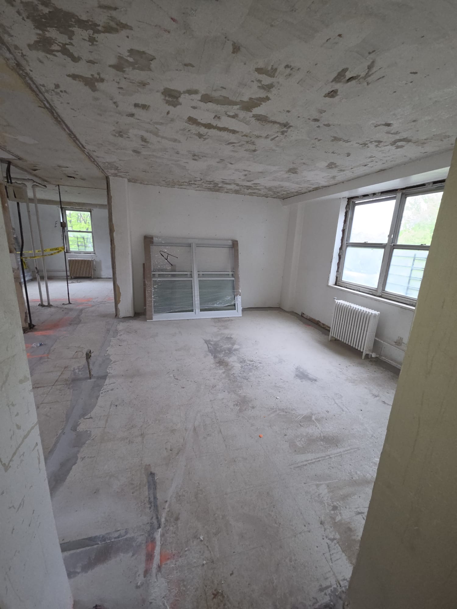 Open apartment space during renovation preparation and layout work.